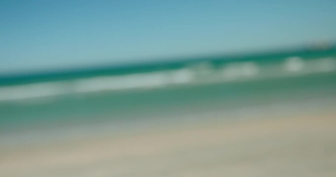 Running, happy and couple of friends ay beach for vacation, holiday and weekend together. Summer, travel and people with blue sky for bonding, relax and getaway for social hangout, laugh and fun