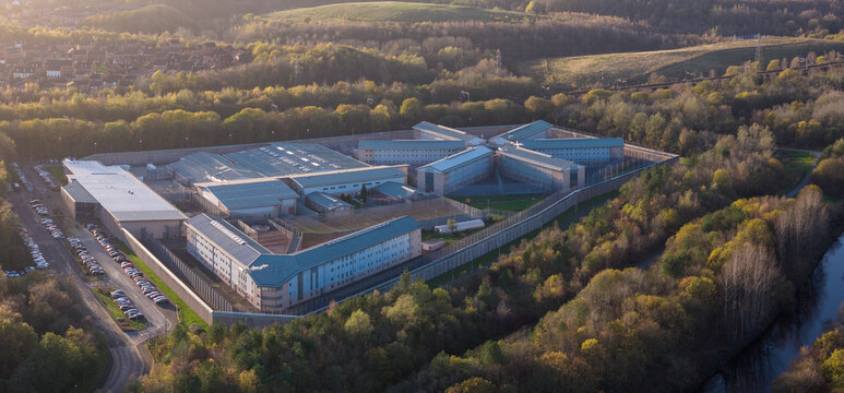 High-Angle View of HMP Forest Bank, Salford Description: Aerial photograph of HMP Forest Bank in Salford, showcasing the facility's unique radial wing design.