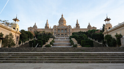 Palau Nacional with fountains and steps on Montjuic at sunset