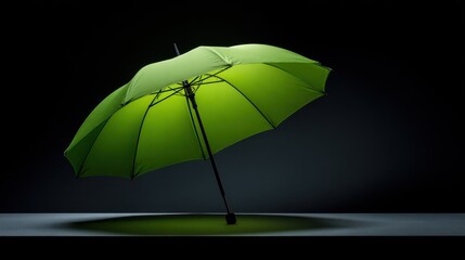 Vibrant green umbrella against a deep black backdrop in dramatic lighting