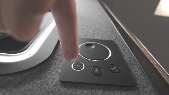 Low angle view of smart lighting control panel interaction