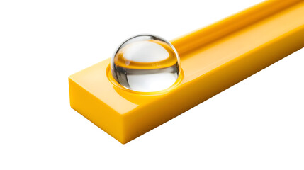 A yellow level tool with a glass bubble on a black background