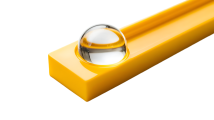 A yellow level tool with a glass bubble on a black background