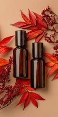 Amber glass cosmetic bottles with red autumn leaves