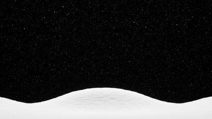 Gentle snow falling over a soft white snowdrift on dark background
