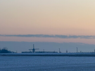 Winter Sunrise Over Windmill Landscape