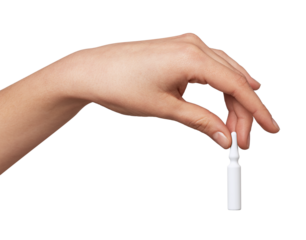 Hand gently holding a delicate white ampoule with fingertips, presenting a concept of precise dosage, fragile content, and careful application in medicine, beauty, or healthcare