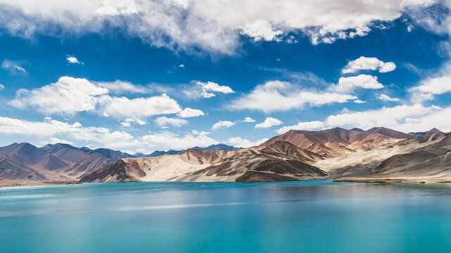 Stunning Turquoise Baisha Lake and White Sand Dunes under Blue Cloudy Sky, Karakoram Highway, Pamir Plateau, Xinjiang, China
