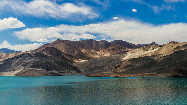 Stunning Turquoise Baisha Lake and White Sand Dunes under Blue Cloudy Sky, Karakoram Highway, Pamir Plateau, Xinjiang, China