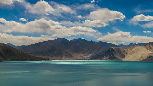 Stunning Turquoise Baisha Lake and White Sand Dunes under Blue Cloudy Sky, Karakoram Highway, Pamir Plateau, Xinjiang, China