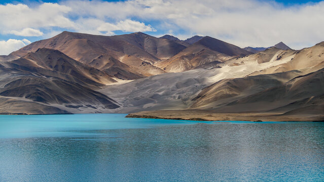 Stunning Turquoise Baisha Lake and White Sand Dunes under Blue Cloudy Sky, Karakoram Highway, Pamir Plateau, Xinjiang, China