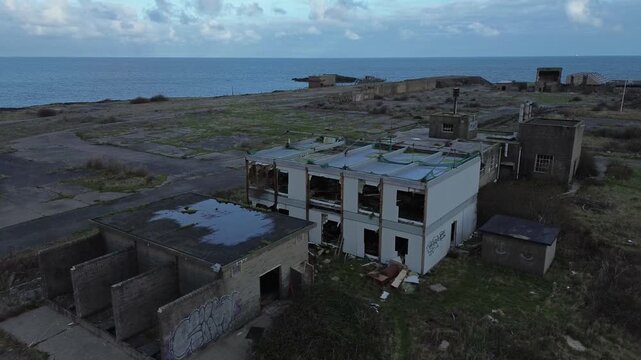 Disused Octel chemical facility aerial descending view over abandoned industrial factory offices