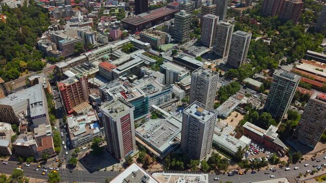 Drone Establishing fly Santiago de Chile City Center Rooftops with UC CHRISTUS Hospital
