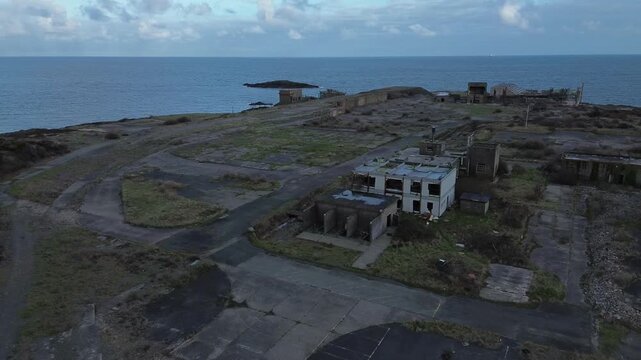 Disused Octel chemical facility aerial view over derelict industrial factory offices and wasteland