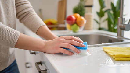 woman cleaning kitchen 