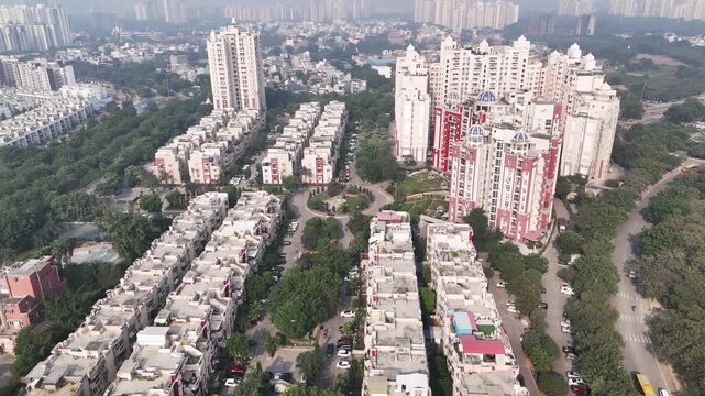 Drone shot over Jaypee Greens, highlighting modern apartment towers, planned urban layout, and green buffers that define this premium residential enclave in Noida.