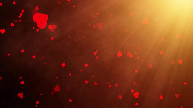 Red heart particles floating against a dark, warm background with bright light rays, romantic loopable animation