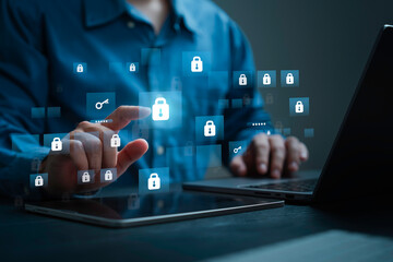 Businessman using laptop computer with Lock icon for Cybernetic attack security, banking and  Personal data. Protecting herself from cyber attacks. Cyber security firewall interface protection.
