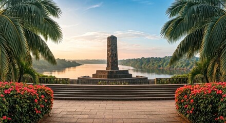 A serene monument overlooks a tranquil river and lush landscape at sunrise