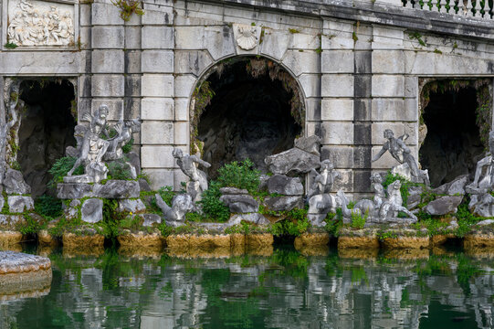 The Fountain of Aeolus in the Royal Park of Caserta with baroque sculptures and arches, Italy