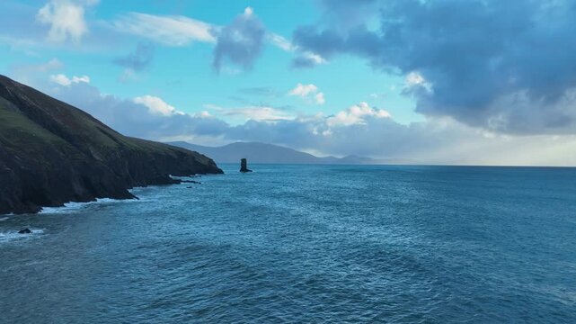 Epic Ireland drone flying over Kenmare bay with mountains of Kerry dramatic seascapes
