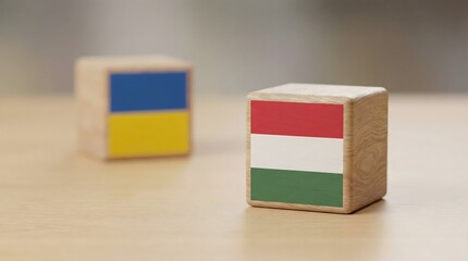 hungary and ukraine flags on wooden blocks