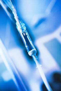 Light effect and blue colored image of parenteral nutrition in the ward at the hospital. Feeding tube dripping