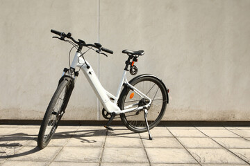 Bicycle isolated on a wall background, with copy space for text