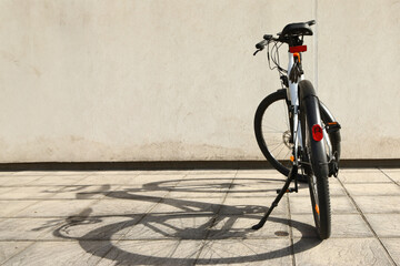 Bicycle isolated on a wall background, with copy space for text