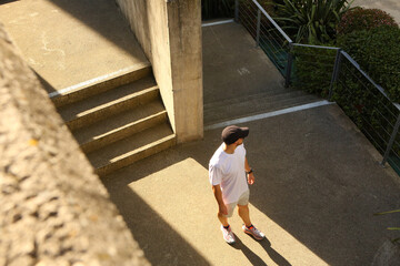 a young man hesitating at a crossroads,