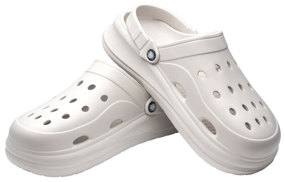 couple of white Crocs Sandals on a white.