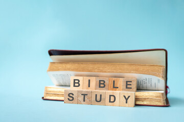 Bible Study on wood blocks, in between pages. 