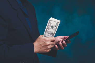 Cash payment with smartphone for digital finance concept.