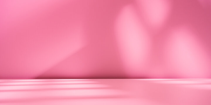 Empty table on bright pink wall background. Composition with abstract shadow on the wall and pink table. Mock up for presentation, branding products, cosmetics, food or jewelry.