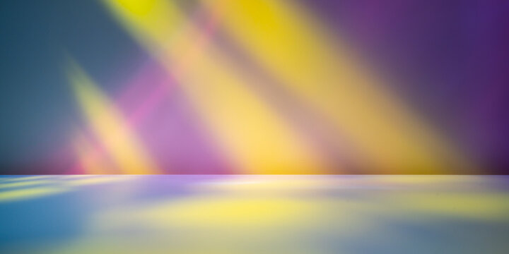  Abstract colorful light beams and prism reflections on a smooth studio background.