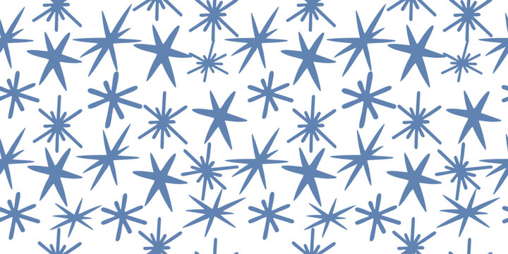 Winter starburst snowflake seamless pattern in blue tones