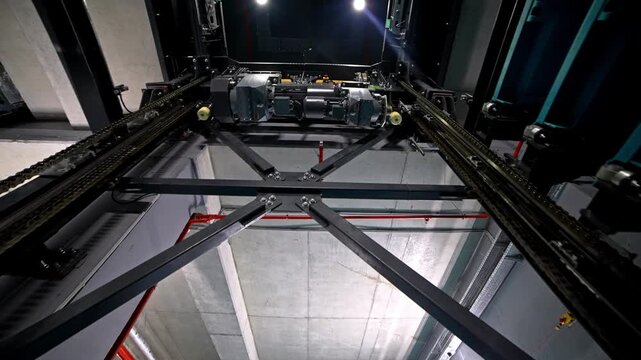 A fully automated smart parking system featuring robotic lifting platforms, mechanical rails, and LED-lit structures operating inside a high-tech multi-level indoor parking facility.