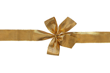 bow made from gift wrapping golden ribbon isolated on white close up
