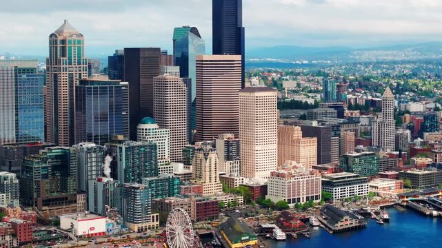 Aerial drone view of downtown Seattle, showcasing skyscrapers, urban streets, and the city skyline from above. Ideal for travel and urban cityscape footage