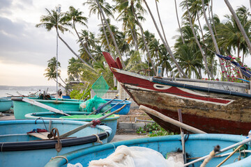 Vietnam traditional basket boats with flags on tropical beach