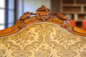 Detail of an antique traditional wooden italian furniture just restored with floral decorations
