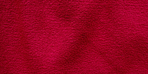 Detailed dark red soft fleece fabric texture © Hendri