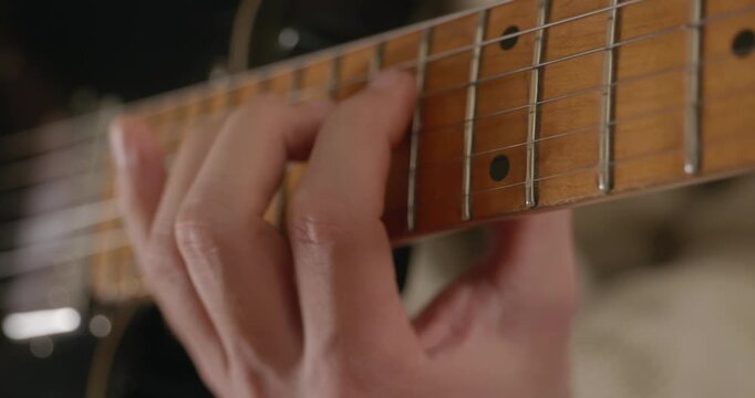 Male Musician Guitarist Plays Electric Guitar at Home Studio. 4K 10-bit