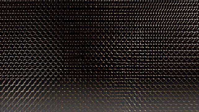 Abstract close-up of a textured metallic surface with hexagonal patterns. Represents modern design, technology, and industrial aesthetics