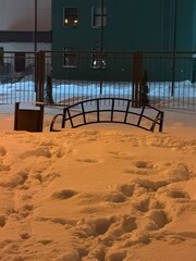  Winter. There's a lot of snow outside. The bench is in the snow. Frosty weather.