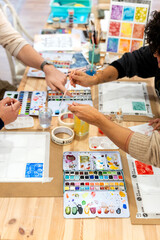 Fototapeta premium People taking adult watercolor painting class learning art techniques