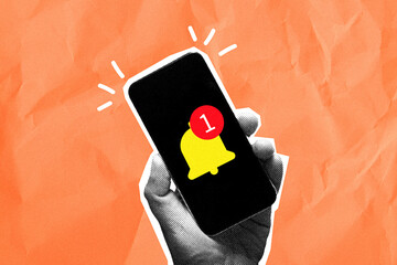 Hand holding mobile phone with yellow bell notification icon.New message alert,notification,digital reminder concept on orange textured background with copyspace.,Contemporary art collage style.