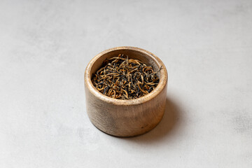 Golden Loose Leaf Tea in Wooden Cup