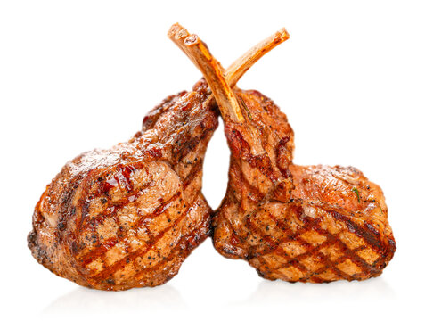 Grilled lamb chops with golden crust and herbs, isolated, perfect for restaurant menu, gourmet cuisine and meat concept
