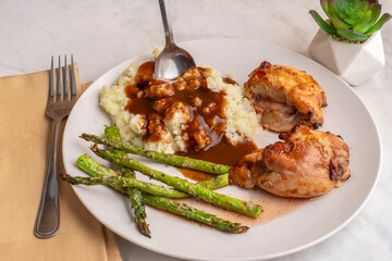 barbecue chicken thighs  with mashed potatoes  and gravy